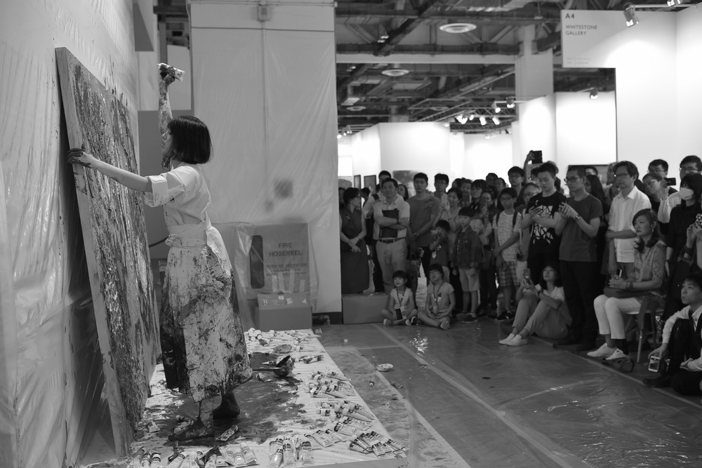 Japanese artist Miwa Komatsu performing live painting at Art Stage Singapore in 2018. News 16 January 2019