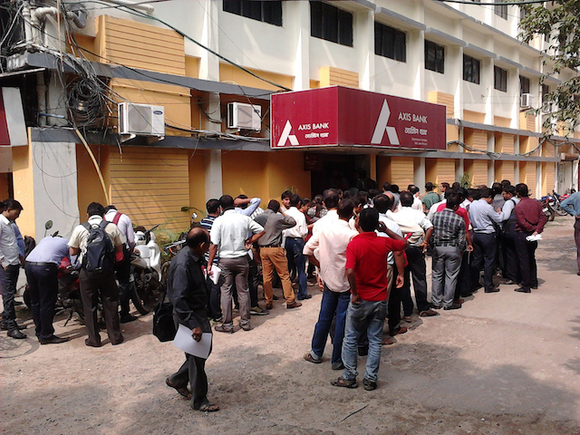 People queueing outside a private bank to deposit and exchange 1,000-rupee notes during the Modi government’s 2018 demonetisation drive. ARA Summer 2019 Opinion