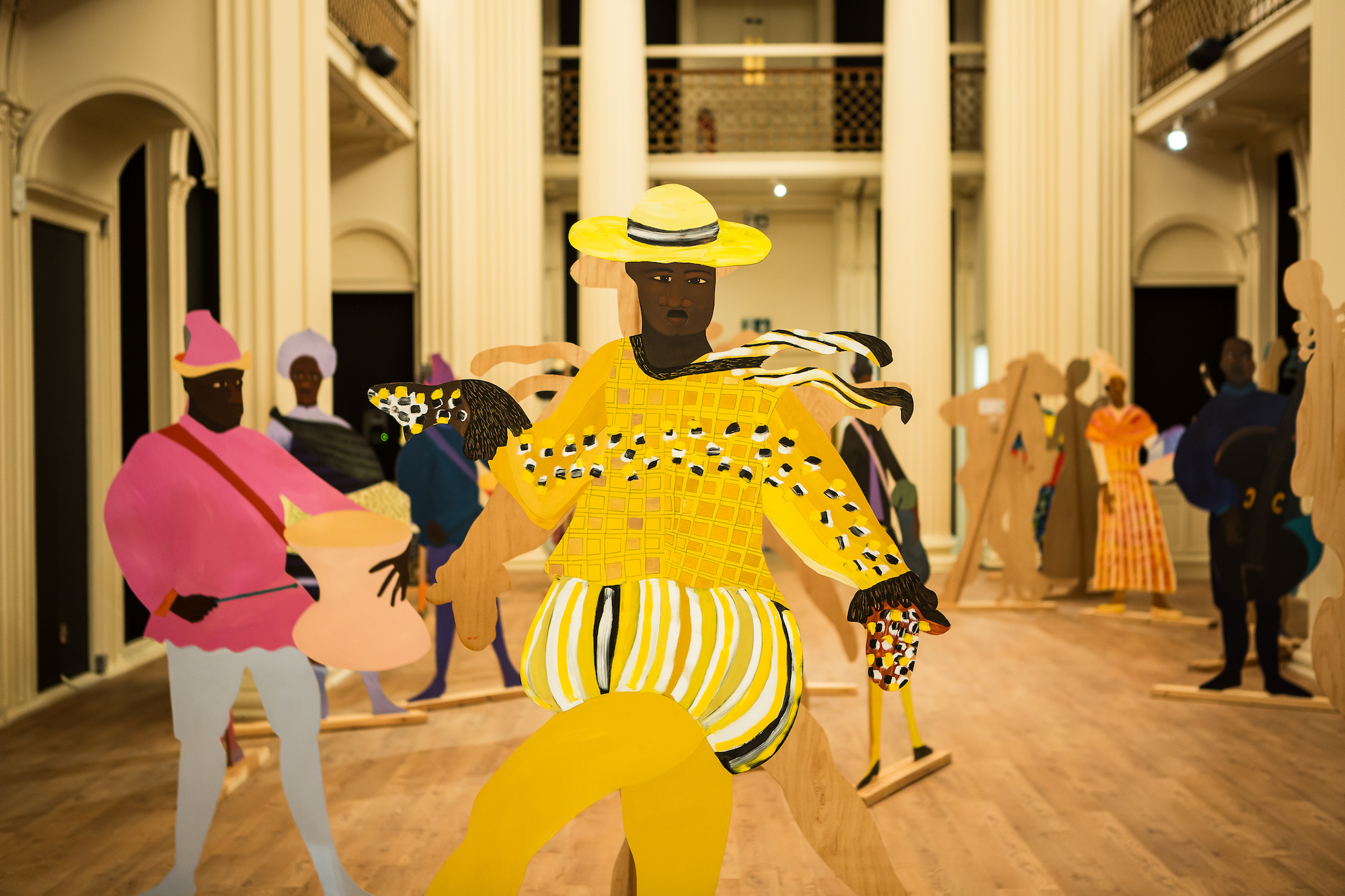 Lubaina Himid, Naming the Money, 2004, hand-painted wooden figures, close-up installation view The Accursed Share, 2023. Photo: Sally Jubb. Courtesy of Talbot Rice Gallery, University of Edinburgh