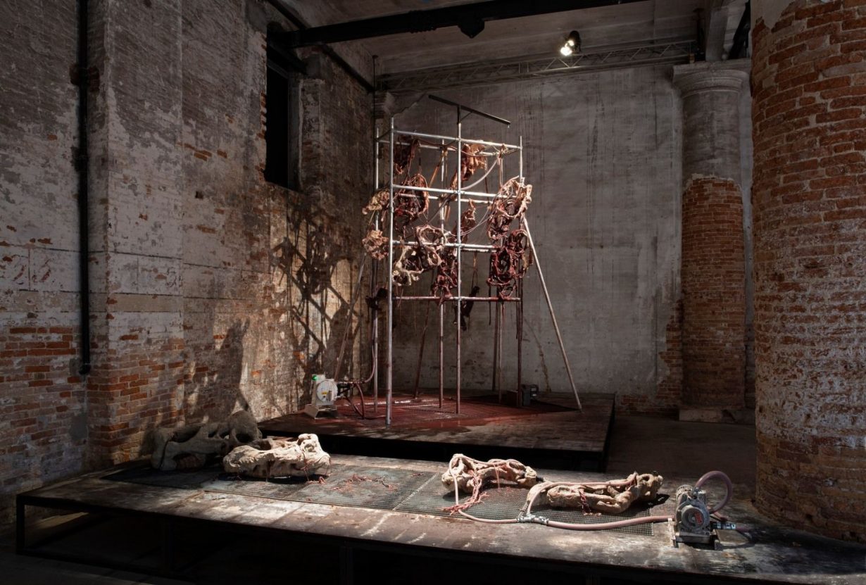 Mire Lee, Endless House: Holes and Drips, 2022, multiple ceramic sculptures on a scaffold, lithium carbonate and iron oxide glaze liquid, pump, motor, and mixed media, 71 × 39 2/5 × 157 2/5 inches (180 × 100 × 400 cm). Installation view of The Milk of Dreams, 59th International Art Exhibition, Venice Biennale. Courtesy of the artist and Venice Biennale. Photo: Sebastiano Pellion di Persano