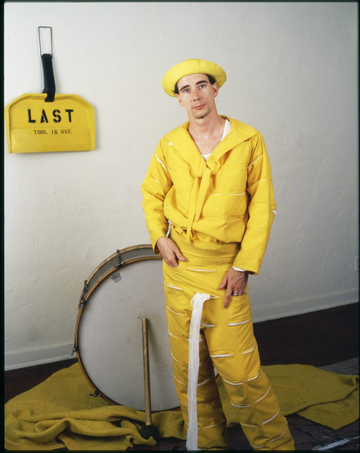 Mike Kelley as The Banana Man, c. 1983, with (in the background) Last Tool in Use, 1977, enamel, 74 × 55 × 8 cm. Photo: Jim McHugh