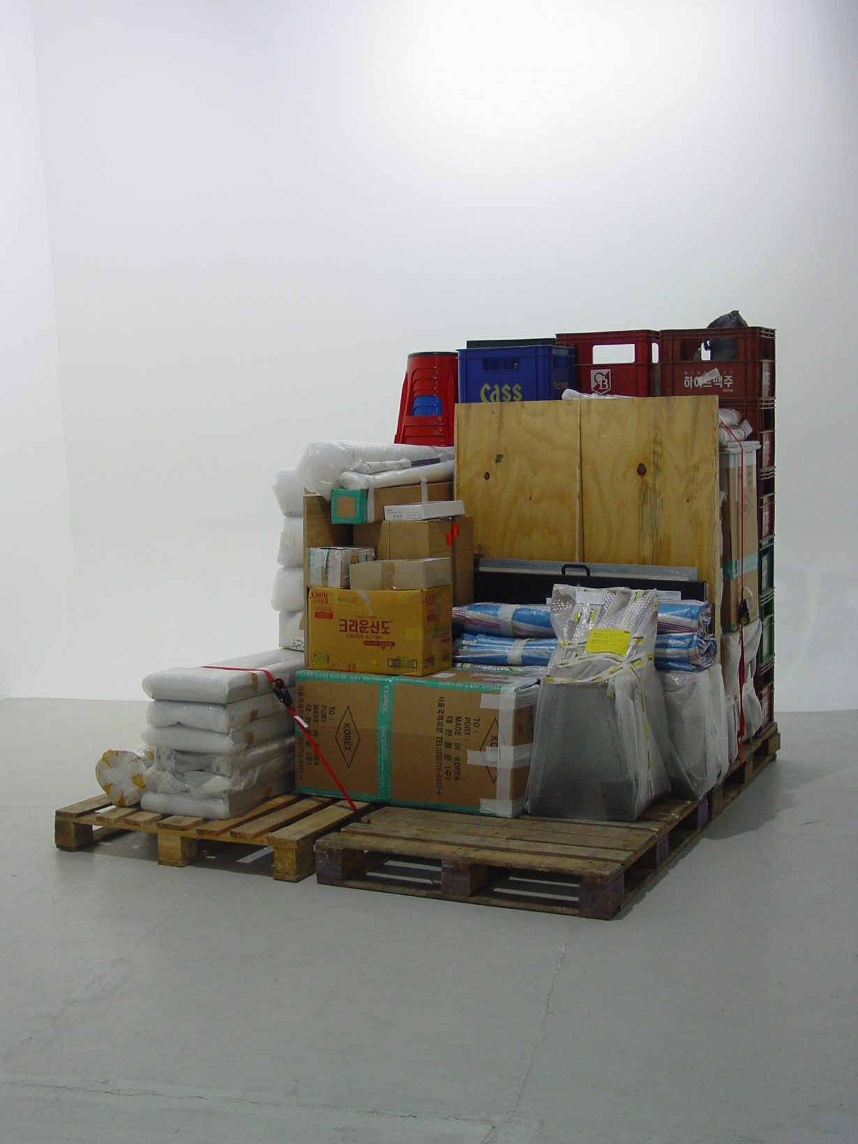 Haegue Yang, Storage Piece, 2004. Wrapped and stacked art works, europallets. Dimensions variable. Haubrok Collection, Berlin. Installation view of Alterity Display, Lawrence O’Hana Gallery, London, 2004. Photo: Lawrence O’Hana Gallery