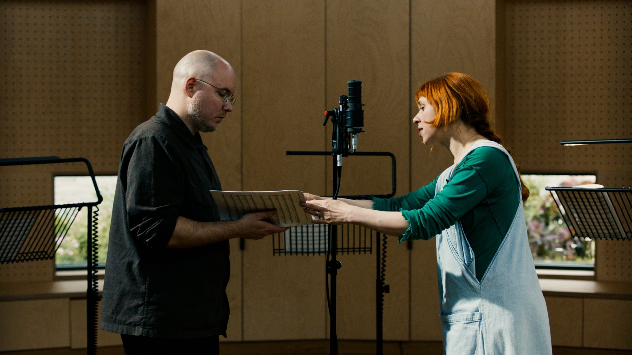 Mat Dryhurst and Holly Herndon conduct a recording session with London Contemporary Voices in London for The Call, 2024. Courtesy Foreign Body Productions, London