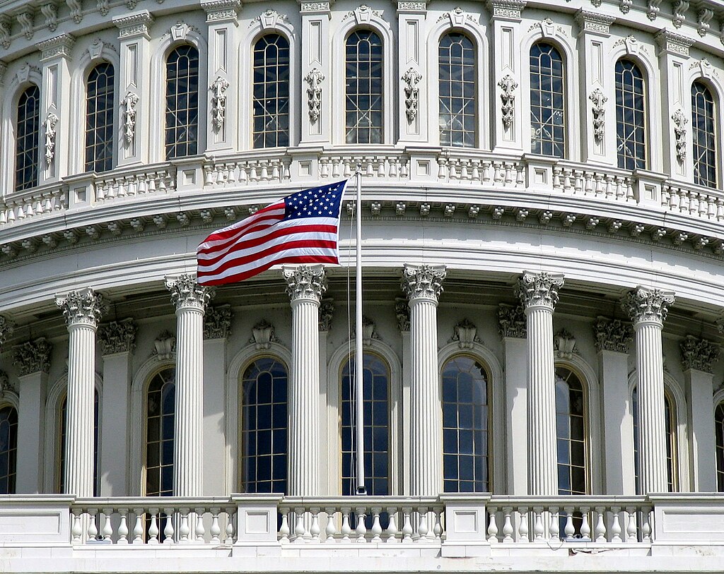 Close-up of the Rotunda of the US Capitol with flag, 2004. Photo: Bobt54, CC BY 3.0, via Wikimedia Commons