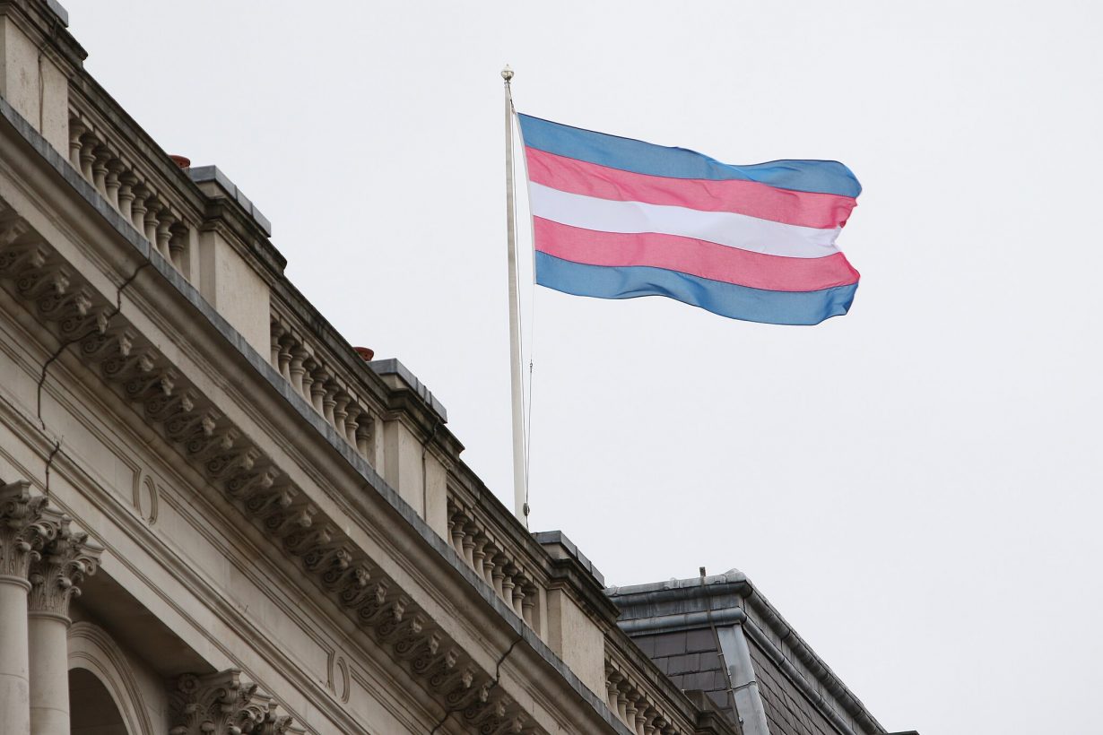 The Transgender Pride Flag flies on the Foreign Office building in London on Transgender Day of Remembrance, 2017 Photo: Foreign and Commonwealth Office, CC BY 2.0, via Wikimedia Commons