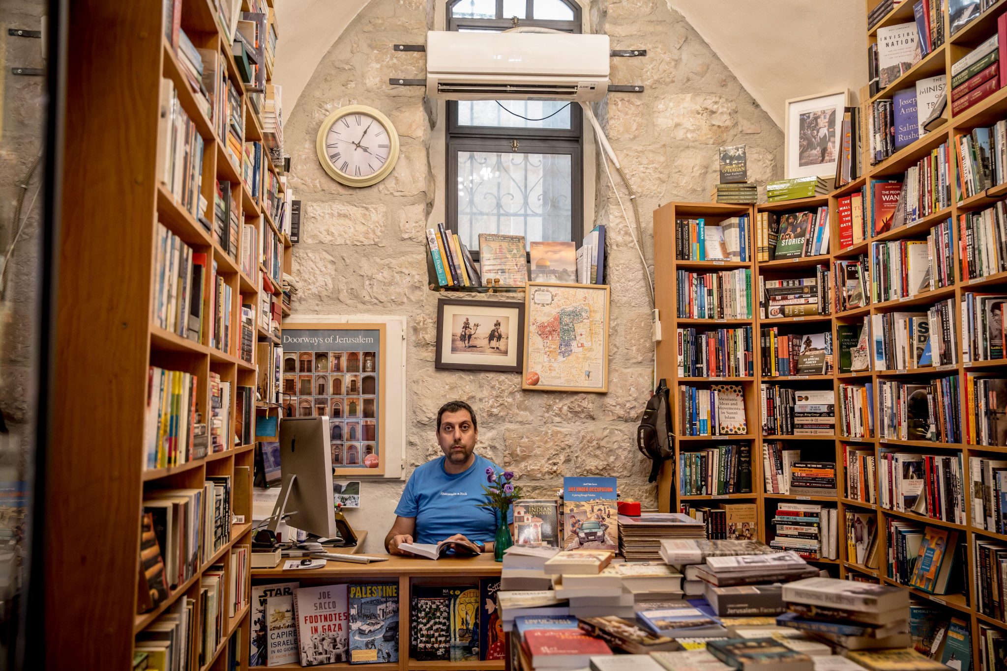 Mahmoud Muna in a branch of East Jerusalem’s Educational Bookshop, July 2024. Photo: Sally Hayden/SOPA. Images/Sipa USA). Credit: Sipa US/Alamy Live News