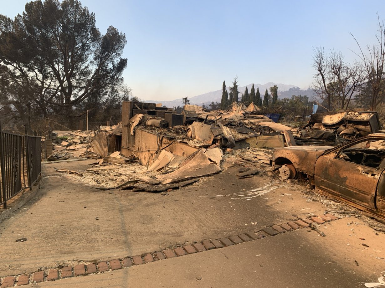 Damage to a home and vehicle from the Eaton Fire in northern Altadena, California. Photo © CAL FIRE Official, via Wikimedia Commons