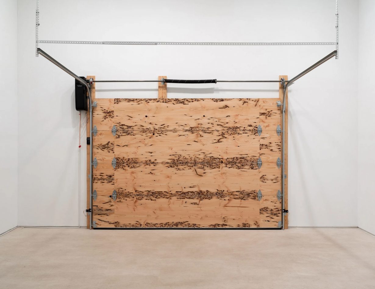 Flint Jamison, Jersey Barrier Mold, installation View, 2025, fir and purple heart wood, metal, motor.  Courtesy Miguel Abreu Gallery and the artist