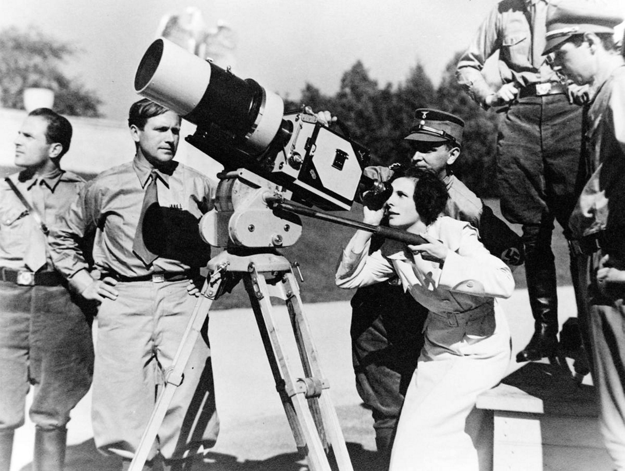 Leni Riefenstahl (1902-2003) looks through the lens of a large camera prior to filming the 1934 Nuremberg Rally in Germany. Exact date unknown