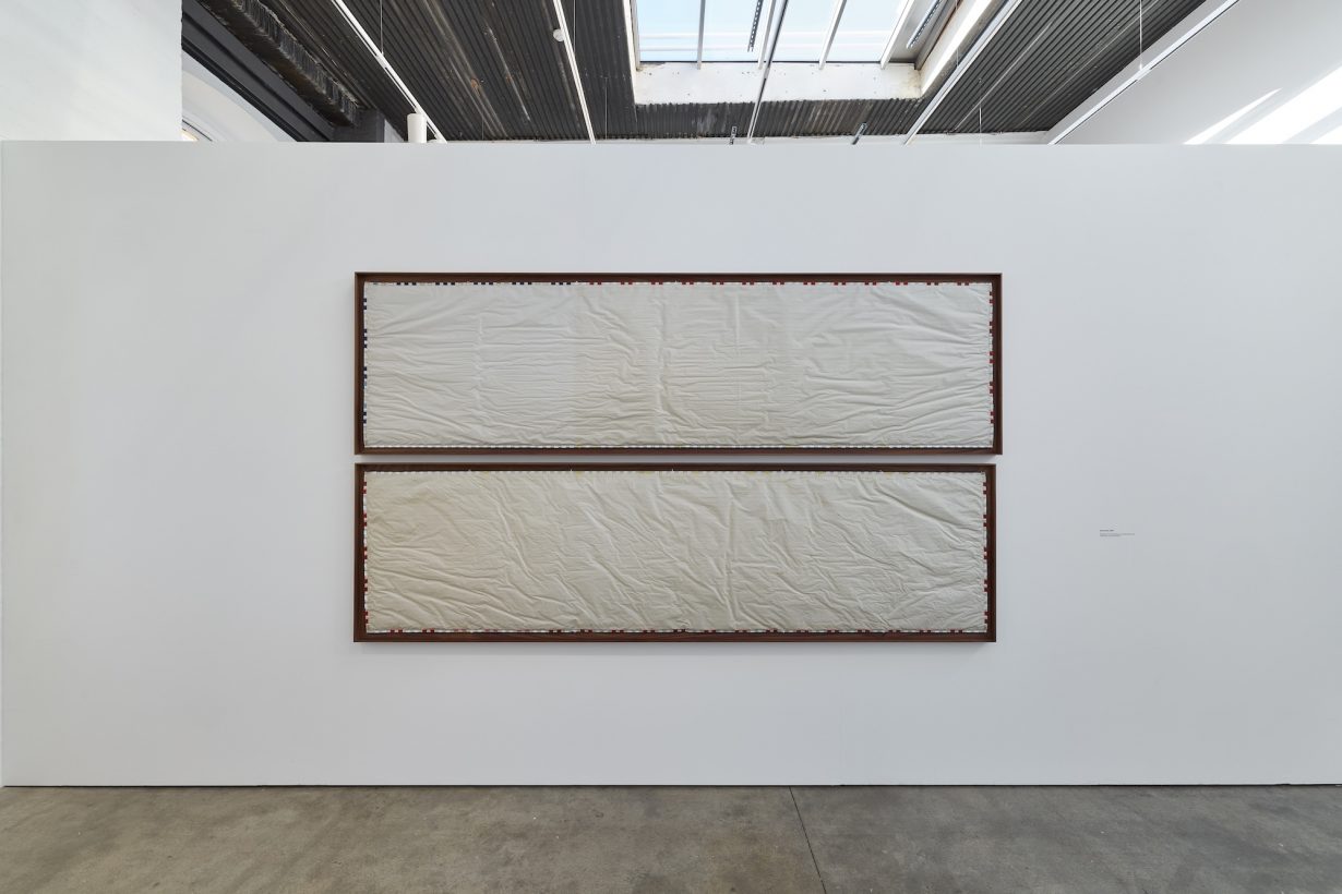 Two rectangular works on a wall