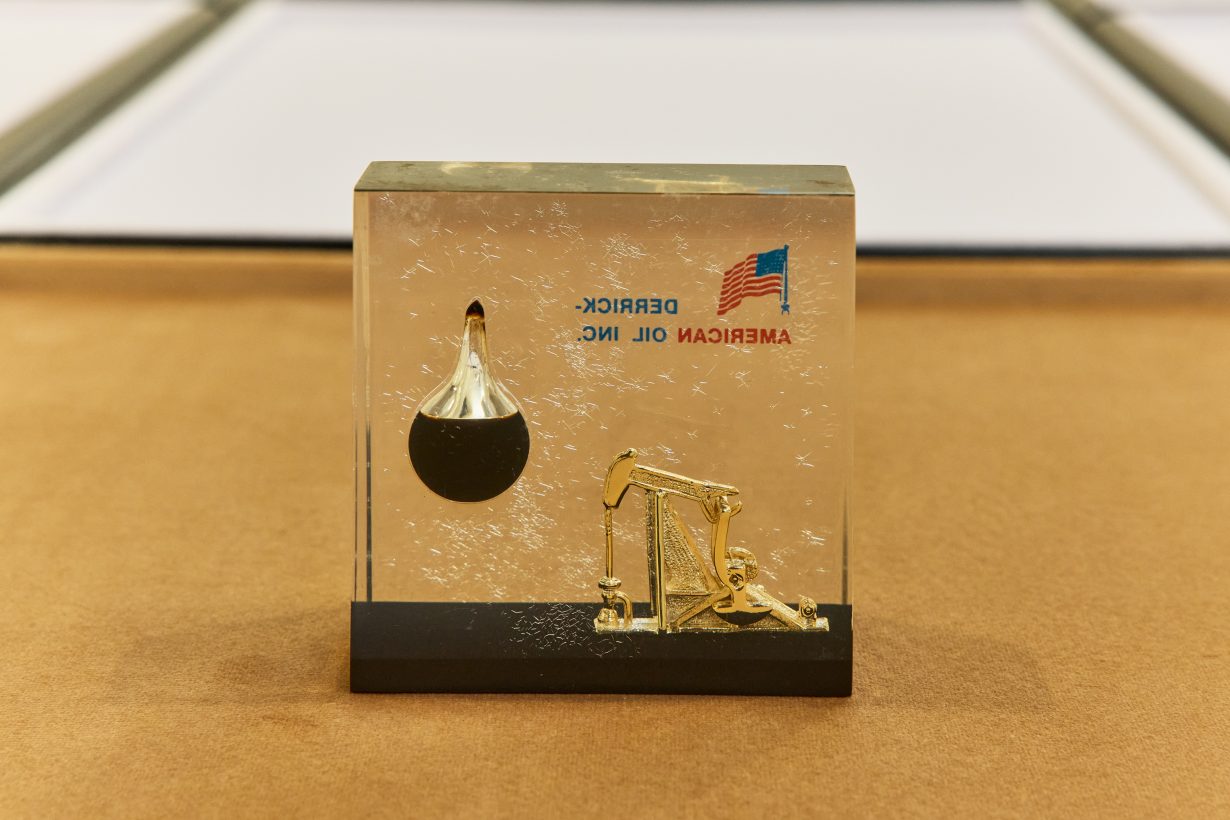 A paperweight with the American flag and crude oil decorations