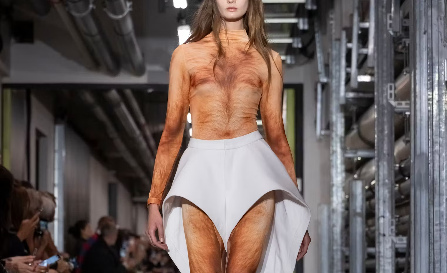 A model on the JPG SS26 runway wearing a hairy naked bodysuit