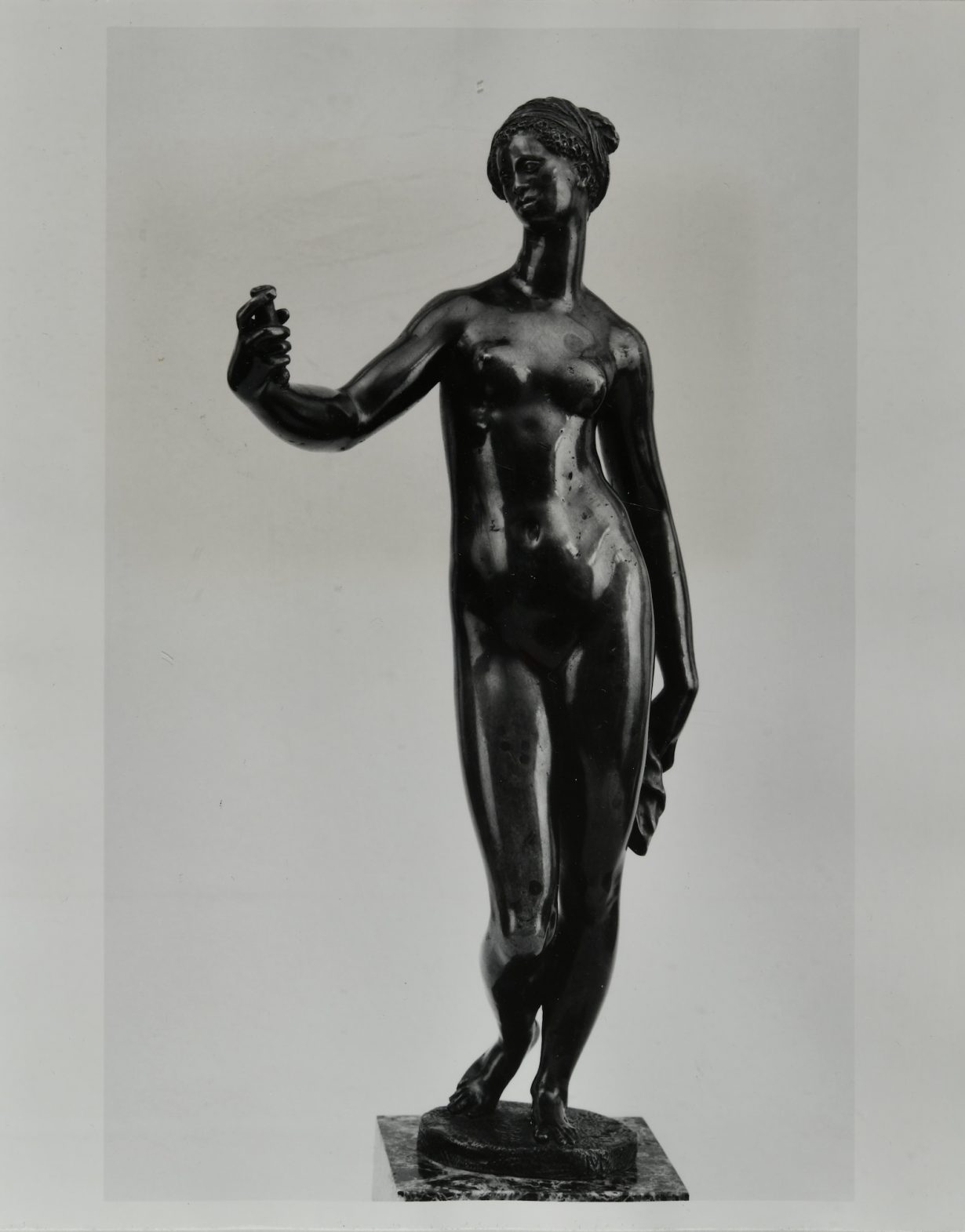 A black classical statue of a female