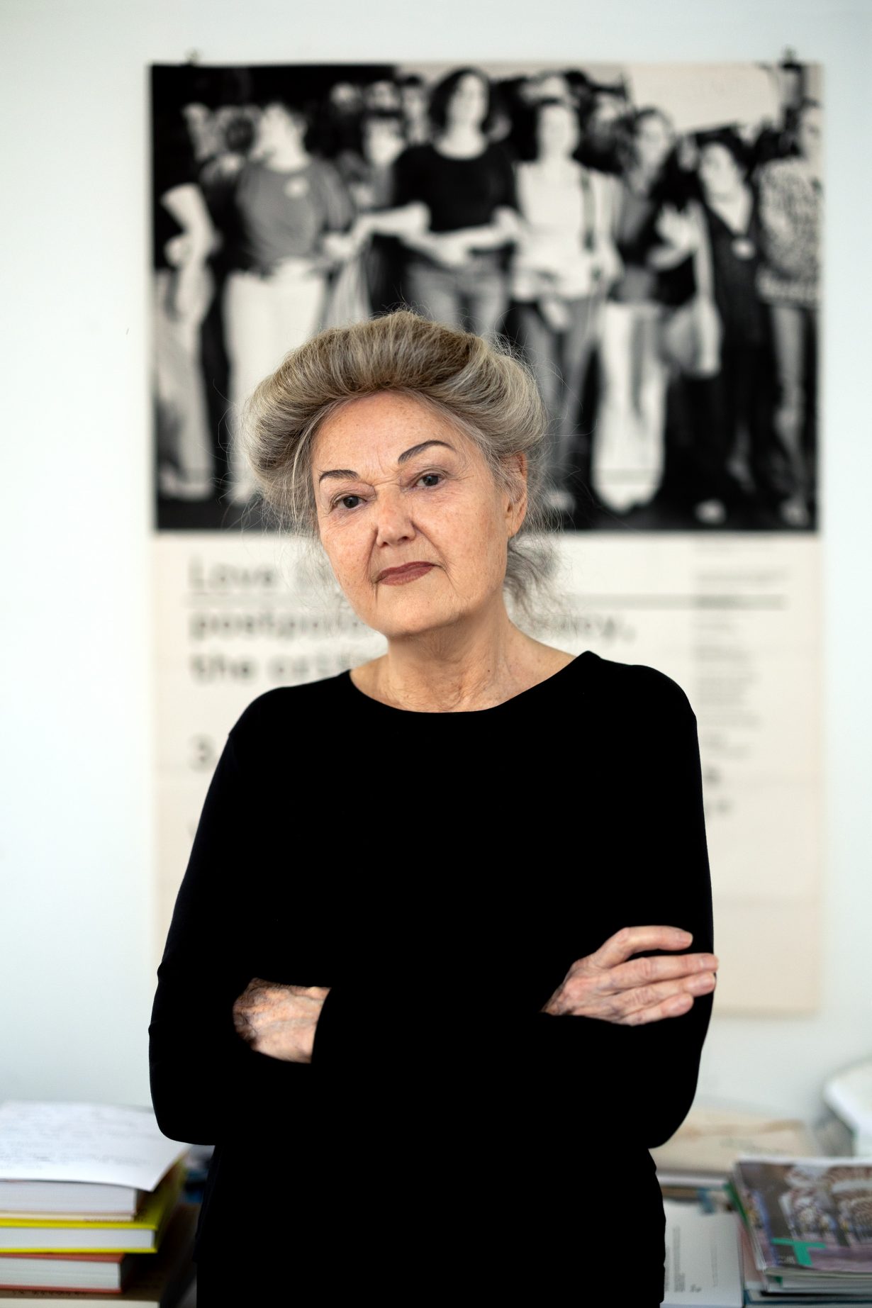 The artist with her arms folded