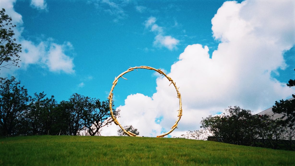 A circle in front of a blue sky 