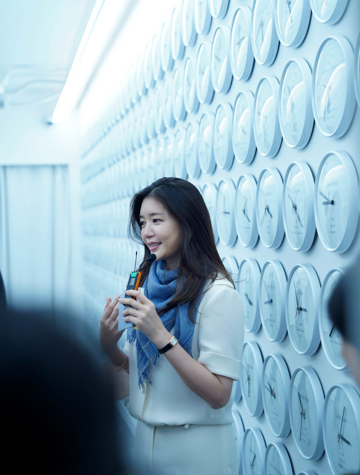 A woman with a walkie talkie