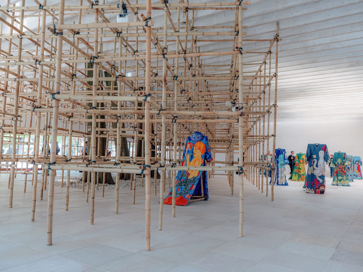 A large bamboo structure in a gallery