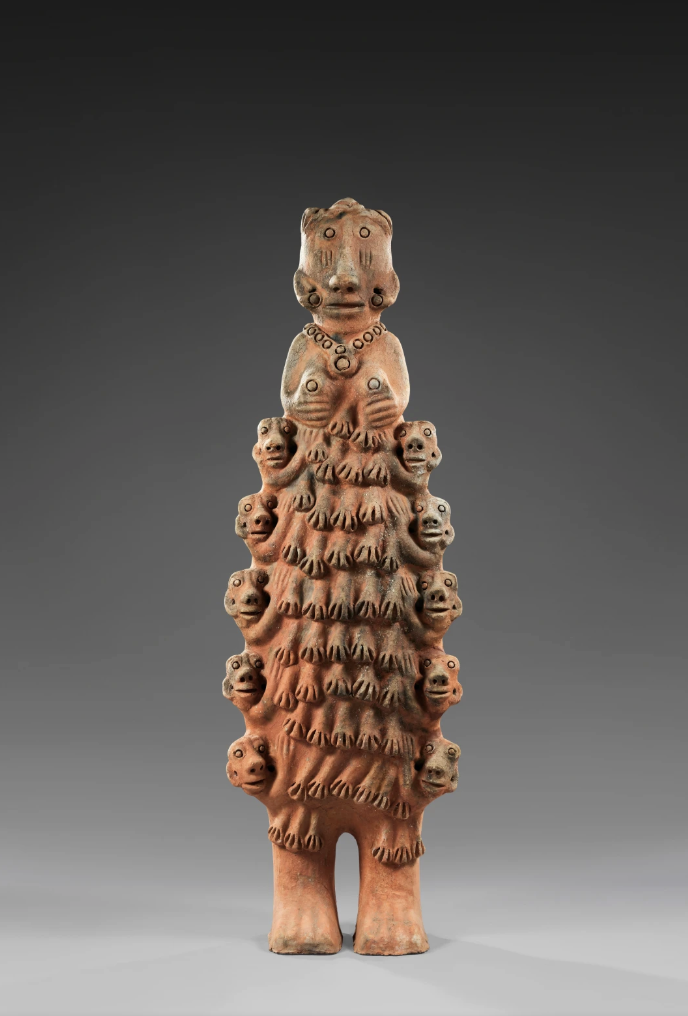 Ceramic sculpture featuring multiple heads and hands by Seyni Awa Camara