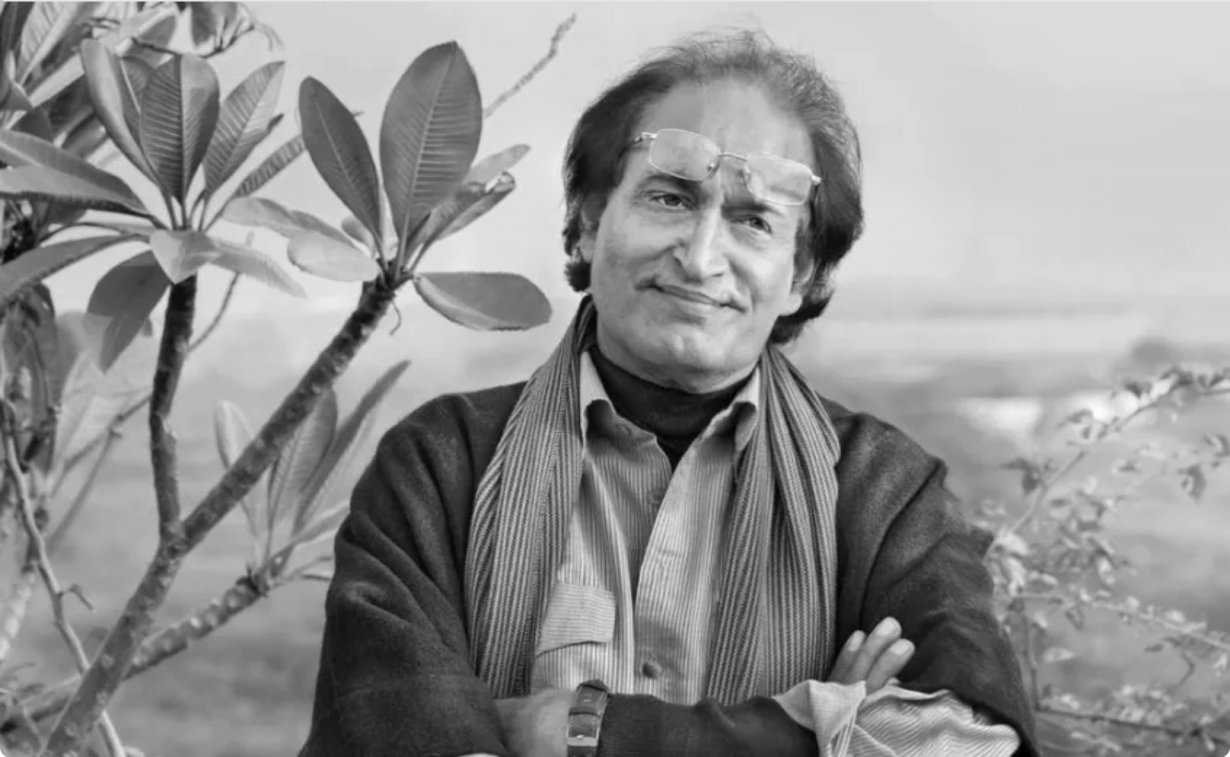 Photography of Raghu Rai standing cross armed in a garden