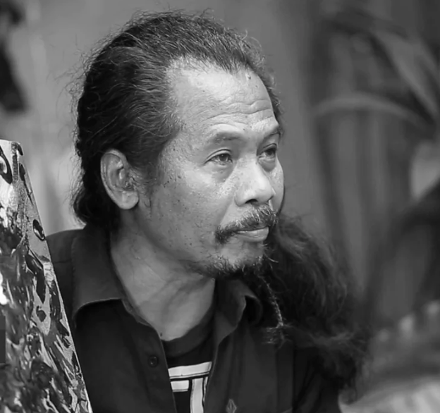 black and white headshot of the Indonesian artist Nasirun